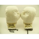 A PAIR OF BOXING GLOVES, signed by Lloyd Honeyghan the 1986-7 World Welterweight Champion