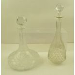 A CUT GLASS SHIP'S DECANTER with faceted ball stopper and one other DECANTER of tear drop form, with