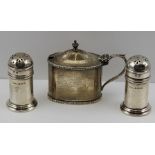 A PAIR OF GEORGIAN DESIGN SILVER PEPPERS, Birmingham 1927, together with an oval MUSTARD POT of