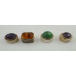 A COLLECTION OF FOUR WHITE METAL BOXES, each mounted, two with polished cabochons of amethyst, one