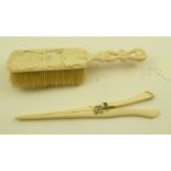A LATE VICTORIAN CARVED IVORY HAIR BRUSH, together with a PAIR OF GLOVE STRETCHERS