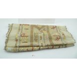 A MIDDLE EASTERN HAND EMBROIDERED MESH TABLE RUNNER, with stylised floral central panel with Turkish