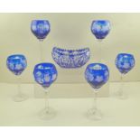 A SET OF SIX 20TH CENTURY BLUE FLASH OVERLAY AND SLICE CUT GLASS STEMMED GOBLETS, with leaf