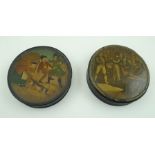 TWO 19TH CENTURY BLACK LACQUER CIRCULAR BOXES, one depicting a fighting scene, the other an interior