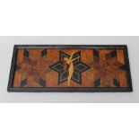 AN ART DECO DESIGN MARQUETRY PANEL/TRAY, decorated with a naked female exercising, over star