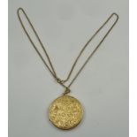 A 9CT GOLD CIRCULAR PENDANT LOCKET, acanthus chased decoration on chain, locket 4cm diameter