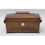 A 19TH CENTURY ROSEWOOD SARCOPHAGUS TEA CADDY, hinged lid opens to reveal a pair of inner domed