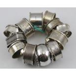 TWELVE VARIOUS SILVER SERVIETTE RINGS, combined weight 170g