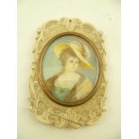 A 19TH CENTURY CARVED IVORY SLIDING VANITY MIRROR with inset miniature painted portrait of a lady,