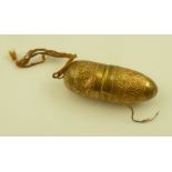 A GILT METAL NECESSAIRE SEWING KIT, the bullet form case opening to reveal a thimble, wooden reel,