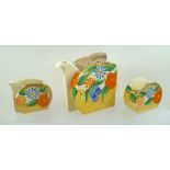 A CLARICE CLIFF BIZARRE THREE-PIECE BACHELOR TEA SET, hand painted in "Canterbury Bells" pattern,