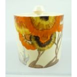 A CLARICE CLIFF BIZARRE CYLINDRICAL PRESERVE JAR WITH COVER, hand-painted in crocus pattern