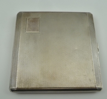 JOHN HENRY WYNN AN EARLY 20TH CENTURY SILVER CIGARETTE CASE, having engine turned decoration,