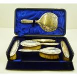 JOSEPH GLOSTER LTD. A SILVER BACKED SIX PIECE LADY'S DRESSING TABLE BRUSH SET, each item with