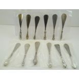 A SELECTION OF TWELVE SILVER HANDLED STEEL SHOE HORNS, one with a fleur de lys style terminal, the