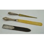 THREE SILVER AND SILVER COLOURED METAL HANDLED LETTER OPENERS, one Oriental example decorated with a