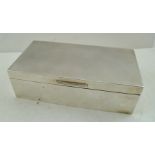 MANTON LTD. A RECTANGULAR SILVER CIGARETTE BOX having engine turned decorated lid, hinged, with