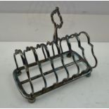 W.S. HUTTON & SONS A LATE VICTORIAN SIX SLICE SILVER TOAST RACK of fancy wire form, with central