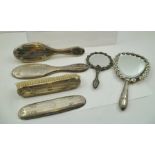 AN ASSORTMENT OF SIX VARIOUS SILVER HANDLED AND BACKED HAIR BRUSHES etc. to include; two hand