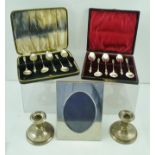 HAYES & CO. A PAIR OF SILVER DWARF CANDLESTICKS, Birmingham 1912, TWO CASES OF COFFEE SPOONS with