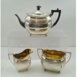 WILLIAM & JOHN BARNARD A LATE VICTORIAN SILVER THREE PIECE TEASET of fancy oval octahedral surround,