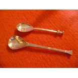 TWO SILVER SPOONS BY THE GUILD OF HANDICRAFT, one of 17th century rattail design with cast knop