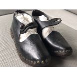 A PAIR OF 19th CENTURY LEATHER, IRON & BRASS STUDDED CHILDREN'S CLOGS