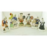 A COLLECTION OF CERAMIC FIGURES includes two depictions of Falstaff, Staffordshire flatbacks and a