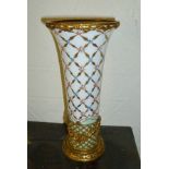 A FRENCH TRUMPET FORM PORCELAIN VASE, gilded and hand-painted in a lattice design, with a gilt metal