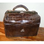 A LATE VICTORIAN CROCODILE EFFECT GLADSTONE STYLE BAG with monogram letter 'M' in silver, 36cm wide,