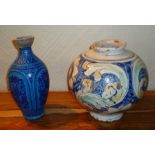 A MAJOLICA GLOBULAR VASE, 25cm high, together with an IZNIK DESIGN BALUSTER VASE, 27cm high