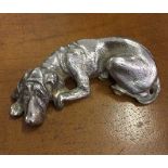 A CAST METAL FIGURE OF A BLOODHOUND, RESTING