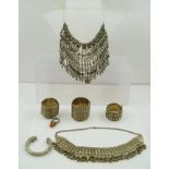 A QUANTITY OF WHITE METAL BEDOUIN JEWELLERY, includes tubular hinged form bracelets, necklace,