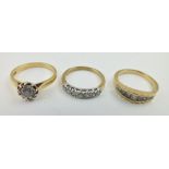AN 18CT GOLD SOLITAIRE DIAMOND RING, size "O", together with TWO 9CT GOLD DIAMOND SET RINGS (3)