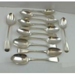 A MATCHED SET OF TWELVE SILVER DESSERT SPOONS of fiddle pattern design, mostly London, but one