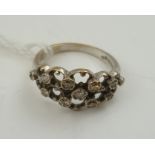 AN 18CT WHITE GOLD LADY'S DRESS RING, inset with diamonds all over, size M