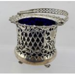 JAMES DIXON & SONS LTD. AN EDWARDIAN SILVER SUGAR BASKET with blue glass liner, having pierced