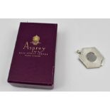 AN "ASPREY" SILVER MOUNTER CIGAR CUTTER of hexagonal form, with ring suspension, in an "Asprey" card