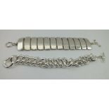 A DESIGNER SILVER BRACELET, having twelve long vertical formed rectangular blocks interspersed