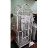 A PAINTED METAL PORTABLE PARROT CAGE
