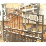 A PAIR OF AUSTENTACIOUS GARDEN GATES, black finished with open spiral twist uprights and metallic