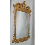A 20TH CENTURY RE-FINISHED GEORGIAN STYLE FANCY GILT FRAMED BEVEL-PLATE WALL MIRROR