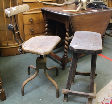 A MID 20TH CENTURY BENCH WORKER'S METAL FRAMED ADJUSTABLE STOOL, with wooden back, bar and solid