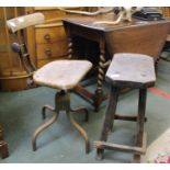 A MID 20TH CENTURY BENCH WORKER'S METAL FRAMED ADJUSTABLE STOOL, with wooden back, bar and solid