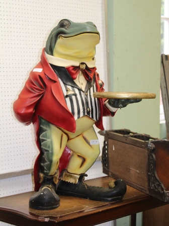 A POLYCHROME DECORATED MODEL FROG FOOTMAN in striped waistcoat holding a gilt coloured circular tray