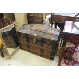 A LATE 19TH CENTURY LEATHER, METAL AND WOODEN BOUND DOMED TOPPED STEAMER TRUNK