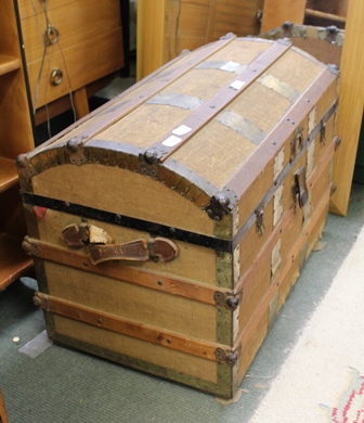 A WOOD AND METAL BOUND HESSIAN COVERED DOME TOPPED STEAMER TRUNK with steamer trunk with original