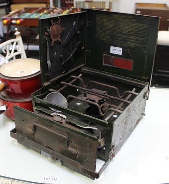 A MILITARY FIELD STOVE with instructions and attachments, together with TWO LIDDED LE CREUSET