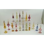 A COLLECTION OF EIGHTEEN BLOWN GLASS ITALIAN SCENT BOTTLES, with stoppers, possibly Murano,