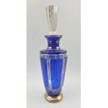 A MOSER CRYSTAL LIQUEUR DECANTER, blue flashed panels, gilded, complete with a tapering hexagonal